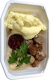 Köttbullar med mos, gräddsås och rårörda lingon