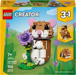 Söt hamster med blomma